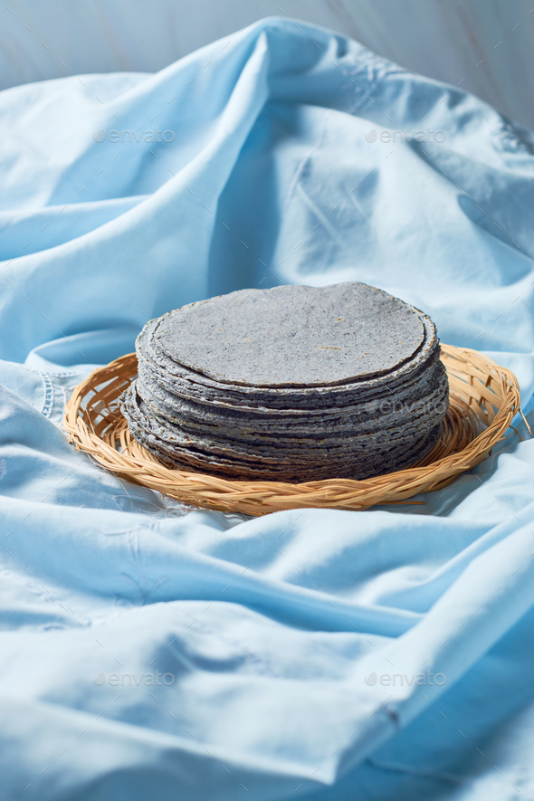 Stacked Mexican blue tortillas, made with blue corn. Stock Photo by